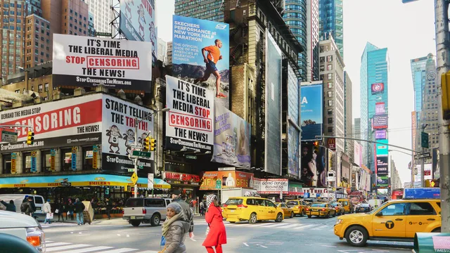 Times Square bustling with taxis and striking billboards. A vibrant downtown scene in New York City. Cross-border messaging, US and Canadian advertising standards compared